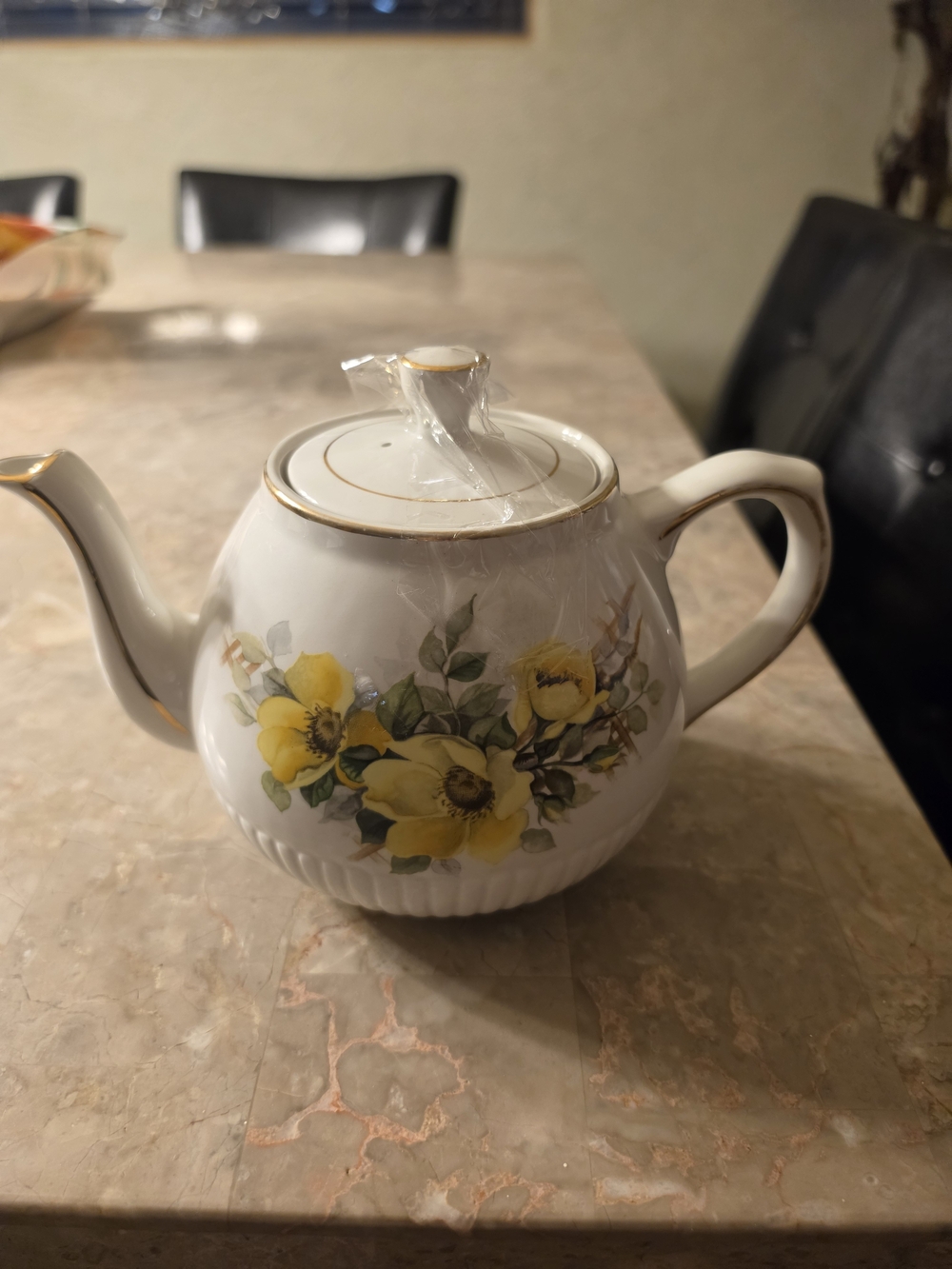 Classic White Ceramic Teapot with Yellow Floral Design